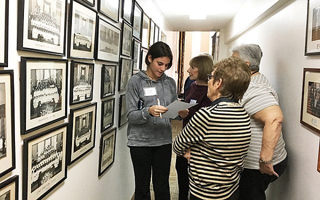Avery Schwab, left, consults with Lyn Tull and Diana Apter at the confirmation wall. Photos by Johanna Ginsberg