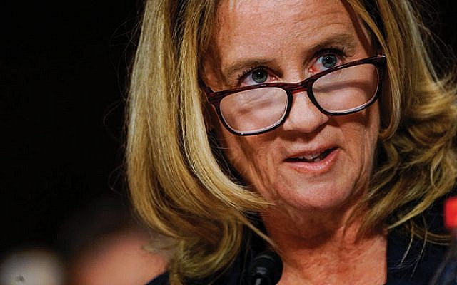Dr. Christine Blasey Ford answers questions at a Senate Judiciary Committee hearing on Sept. 27. Melina Mara-Pool/Getty Images