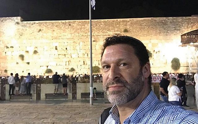 Ari Fuld, shown at the Western Wall in Jerusalem, worked at a nonprofit that provides food and supplies to Israeli soldiers. JTA
