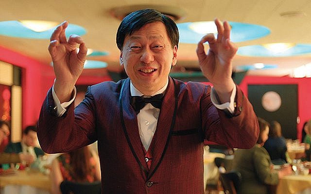 Gaston Poon is one of the waiters in the Chinese restaurant who break into a hora in “Dreaming of a Jewish Christmas.” Photos courtesy Riddle Films Inc.