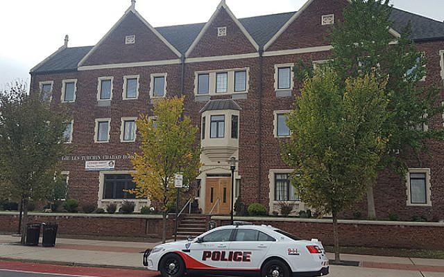 A Rutgers University police car is parked outside Rutgers Chabad on College Avenue, New Brunswick.