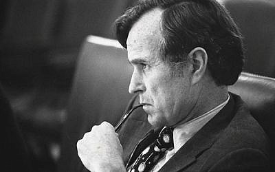 CIA_Director_George_H.W._Bush_listens_at_a_meeting_following_the_assassinations_in_Beirut_1976_-_NARA_-_7064954