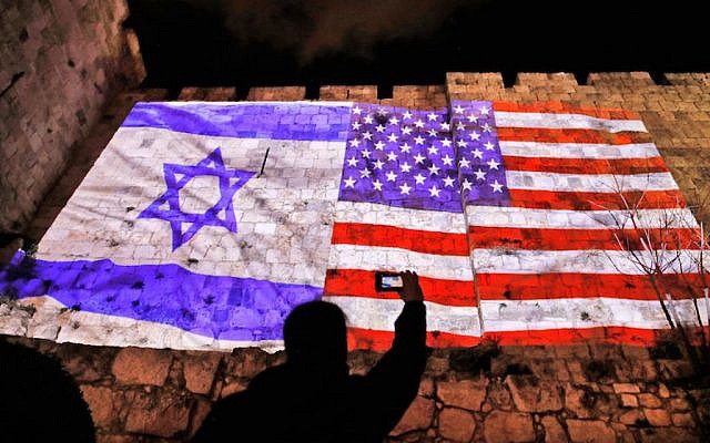 The U.S. and Israel flags on the walls of the Old City in Jerusalem, Dec. 6, 2017. Getty Images