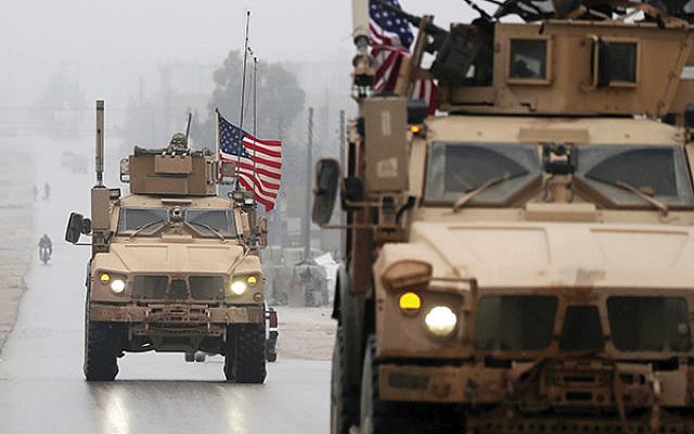 A U.S. troop convoy in Syria. A New York Times columnist argues that isolationist U.S. policy endangers Israel. Getty Images