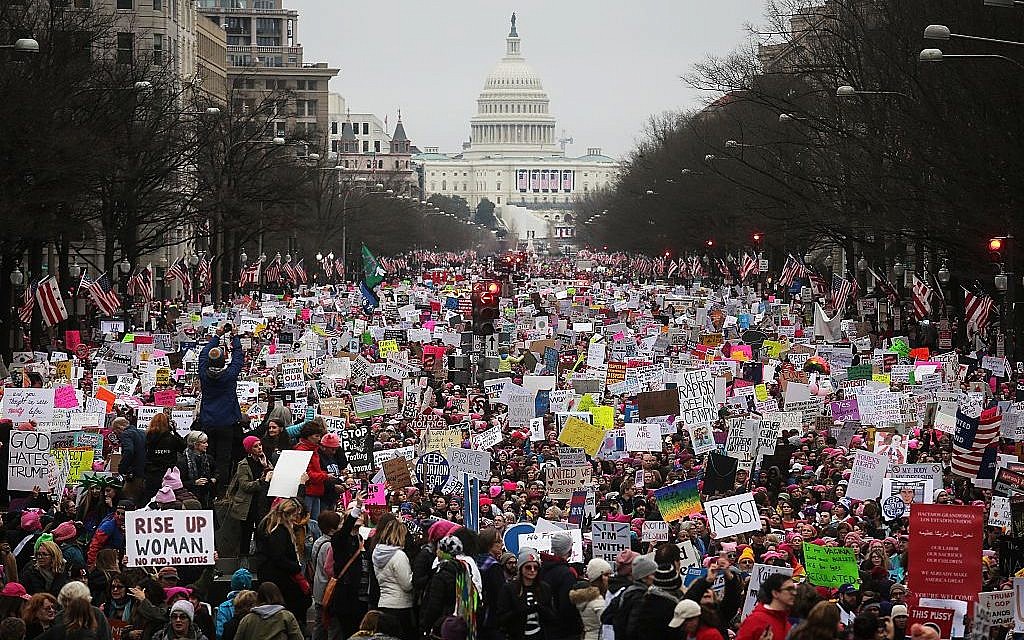 Protesters walk up Pennsylvania Avenue during the Women's March on Washington, with the U.S. Capitol in the background, on January 21, 2017 in Washington, DC. Getty Images