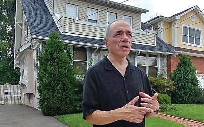In front of the house he grew up in, Michael Takiff recalled the names of neighbors and playmates who lived nearby in the Elmora section of Elizabeth. Photos by Elaine Durbach