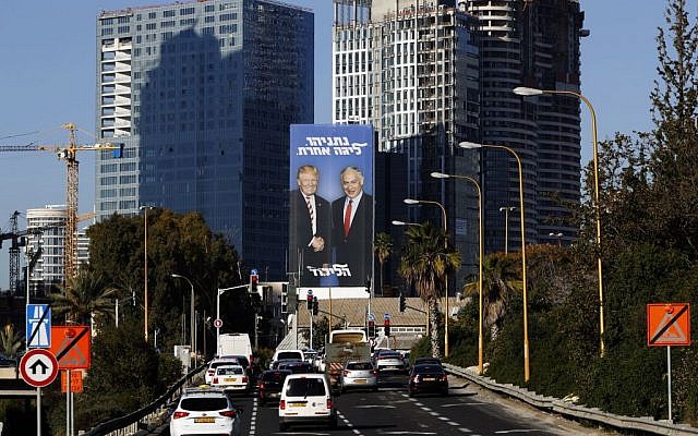 A picture taken on February 3, 2019 in the Israeli coastal city of Tel Aviv shows a giant election billboard of Israeli Prime Minister Benjamin Netanyahu and US President Donald Trump shaking hands. The writing on the billboard reads in Hebrew "Netanyahu, in another league". Getty Images