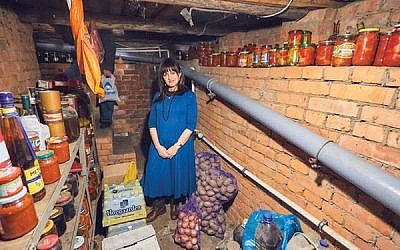Shterney Kanelsky visits the basement where her husband hid from the Soviet authorities for two years as a child, in the family home in a Moscow suburb. 
Photos courtesy Bris Avrohom