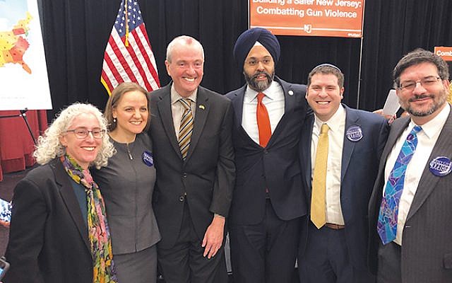 Gov. Phil Murphy and Attorney General Gurbir S. Grewal are flanked by rabbis, from left, Faith Joy Dantowitz of Temple B’nai Abraham in Livingston, Jennifer Schlosberg of the Glen Rock Jewish Center, Jesse Olitzky of Congregation Beth El in South Orange, and Joel Abraham of Temple Sholom in Scotch Plains.