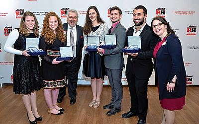 With Rutgers Hillel executive director Andrew Getraer, third from left, and associate senior executive director Rabbi Esther Reed, far right, are the student Rising Stars honored at the Rutgers Hillel gala, from left, Leora Hyman of Teaneck, Talia Schabes of Englewood, Elisheva Sherman of Highland Park, Zach Steinhardt of Morris Plains, and Segev Kanik of Deal. Photos by Mike Schwartz Photography