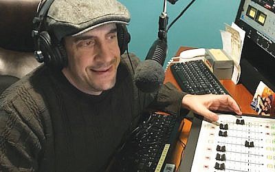 Michael Greenberg pre-records music for his weekly four-hour radio show, which features an eclectic array of Israeli, cantorial, and contemporary Jewish songs. (Photo courtesy Michael Greenberg)