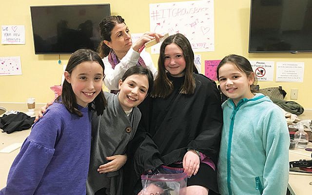 From left, Hannah Rosenfeld, Chloe Henslovitz, Elyse Commer, and Emunah Mischel each donated several inches of hair.