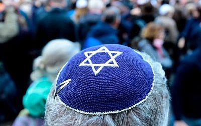 A participant of the "Berlin wears kippa" rally wears a kippa in Berlin on April 25, 2018. - Germans stage shows of solidarity with Jews after a spate of shocking anti-Semitic assaults, raising pointed questions about Berlin's ability to protect its burgeoning Jewish community seven decades after the Holocaust. Getty Images