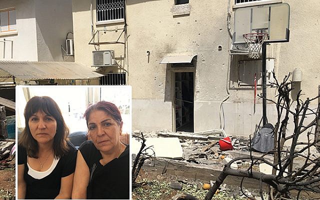 The Ashkelon home of Moshe Agadi, who was killed in a rocket attack from Gaza when he stepped outside for a cigarette. Inset: Agadi’s sisters, Cheli Mualem and Janet Tverya, sitting shiva in a nearby home. Nathan Jeffay/JW
