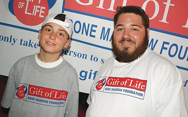 Samuel Aronoff, right, of Highland Park with Mark DeFrancesco Jr., during their first meeting at Shea Stadium in 2004. Aronoff, a Rutgers University student at the time, was a bone marrow donor for DeFrancesco, then 11. Photos courtesy NY Mets