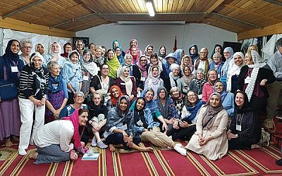 Members of the Sisterhood of Salaam Shalom in the annex of the Dar Assalam Mosque in Berlin, which hosted the group for dinner, prayers, and interfaith dialogue. Photo courtesy Heba Macksoud