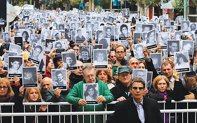 Family members of victims of the 1994 bombing of the Jewish community center in Buenos Aires mark the 25th anniversary of the July 18 attack. HUGO VILLALOBOS/AFP/Getty Images
