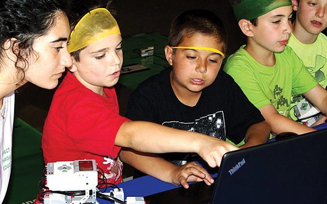 Campers working on computers during the 2018 pilot ORT Start-up Challenge, which has representatives visiting three NJY Camps this week. Photo courtesy ORT