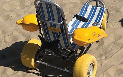 Wheelchairs that can be taken into the water are available upon request (and with lifeguard supervision) at North Bath Avenue Beach in Long Branch. Photo by Martin J. Raffel