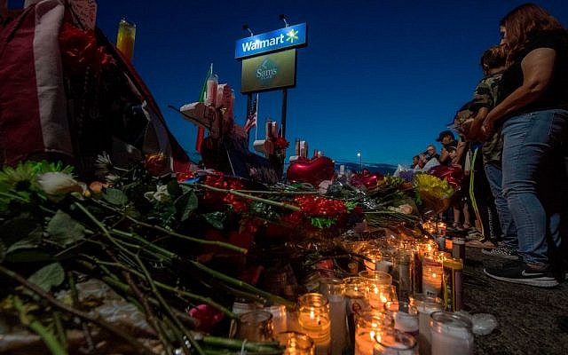 People pay their respects at the makeshift memorial for victims of the shooting that left a total of 22 people dead at the Cielo Vista Mall WalMart in El Paso, Texas, on August 6, 2019. Getty Images