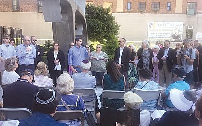 Rabbi Jesse Olitzky of Congregation Beth El in South Orange addresses the crowd in front of the U.S. Immigration and Customs Enforcement (ICE) headquarters in Newark on Tisha b’Av. Photo by Michele Alperin