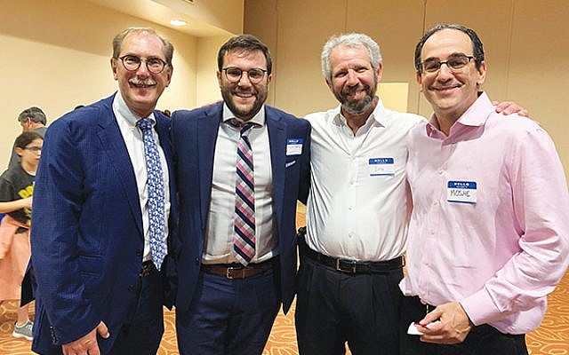 The Kulanu team, from left, Larry Rein, director Binyamim Bromberg, Ira Bloom, and Moshe Glick, all of West Orange, at the Aug. 7 open house. Photos by Johanna Ginsberg