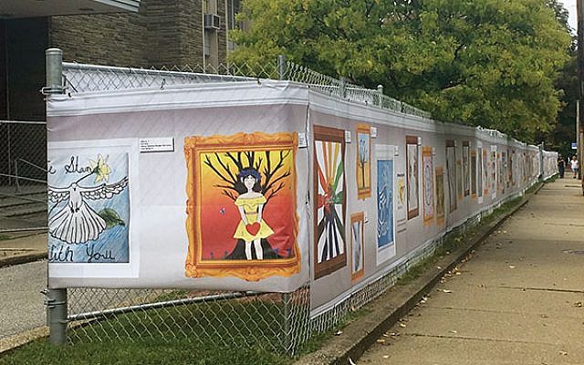 Teens’ artwork, hung on a chain-link fence, rings Tree of Life synagogue. Photos by Beth Kissileff