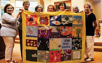 Members of Temple Emanu-El who commissioned the quilt in 2014 include, from left, Judi Kietz, Beverly Brodsky, Lois Steinberg, Helen Friedman, Linda Barr, Barbara Gross, and Jean Goldstein. Photos courtesy Temple SinaI
