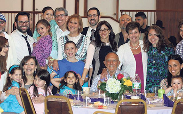 Rabbi Joshua Hess and his wife Naava, center, in black dress, join congregants and family members celebrating the opening of Congregation Anshe Chesed’s new mikva. 