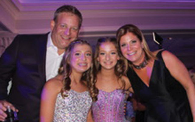 Emma Grunstein, third from left, with her sister, Aerin, and parents, Richard and Randi, at the twins’ b’not mitzva celebration in September. 
