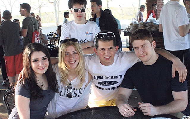 Students from Rutgers’ AEPi Jewish fraternity and Rutgers Jewish Xperience join together in a barbecue celebrating Israeli Independence Day in spring 2014. 