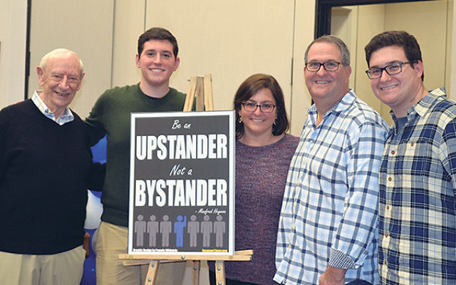 At the screening of Be An Upstander are, from left, Fred Heyman; Howard Goldberg, Heyman’s one-time “twin” who went on to executive produce the film; and his parents, Abby and Joel Goldberg. 