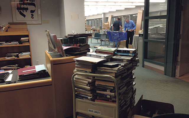 Maintenance workers began dismantling shelves in the Waldor Library in June. Maintenance workers began dismantling shelves in the Waldor Library in June.