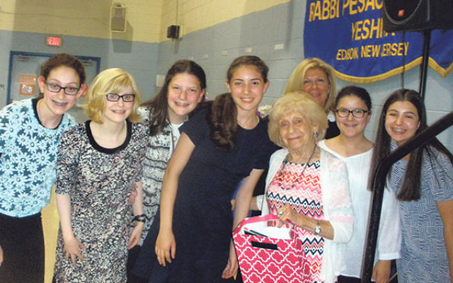 Holocaust survivor Fay Baumfeld with the RPRY student team who interviewed her. 