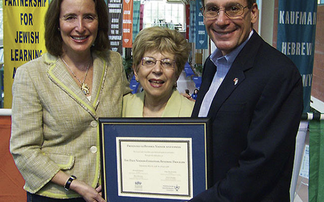 In 2008 Leslie Dannin Rosenthal, left, then chair of the MetroWest federation’s Israel and Overseas Committee, joined Gary Aidekman, past UJA campaign chair, in presenting a plaque to Beverly Nadler of Summit, in recognition of her and her late husb