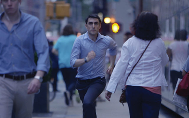 Actor Danny Hoffman running late to meet a date at a kosher restaurant in a scene from “Soon by You.” Photo by Leora Veit
