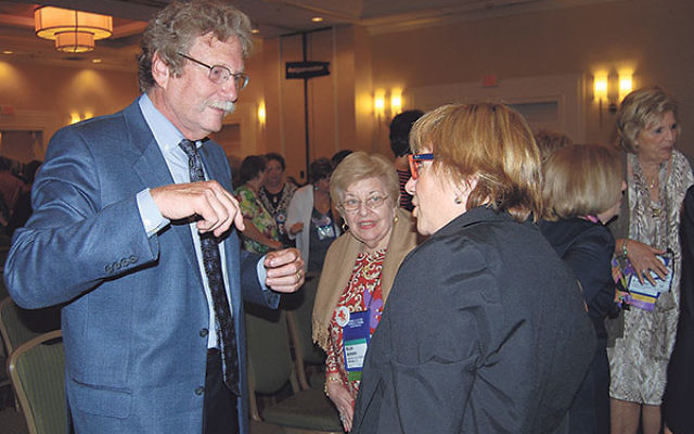 Keynote speaker Rabbi Gordon Tucker talks with participants at the convention of the Women’s League for Conservative Judaism.     