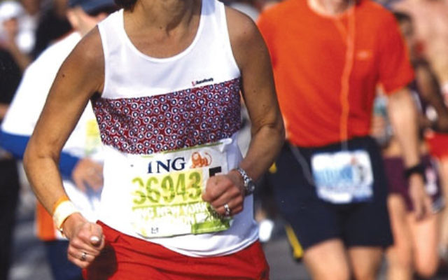 Bonnie Knecht, who will run the ING New York City Marathon for The Blue Card, an organization that provides aid to destitute Holocaust survivors, at the marathon finish line in 2009. Photo courtesy Bonnie Knecht