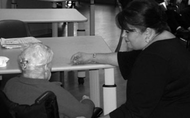 A Greenwood House nurse with a patient A Greenwood House nurse with a patient