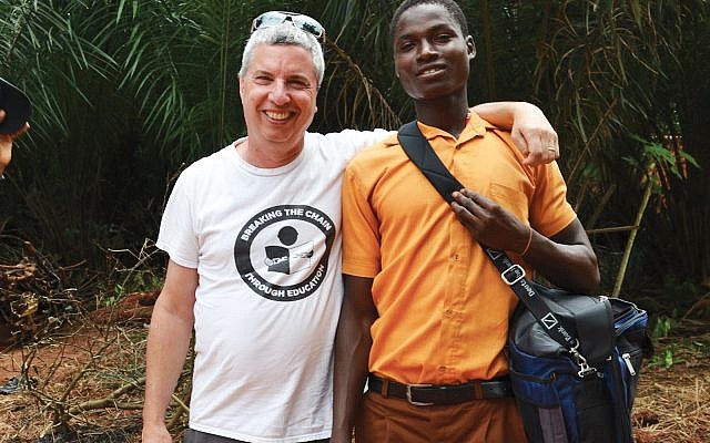 Evan Robbins, left, in Ghana with one of the formerly trafficked children he helped rescue. Photo courtesy of Evan Robbins