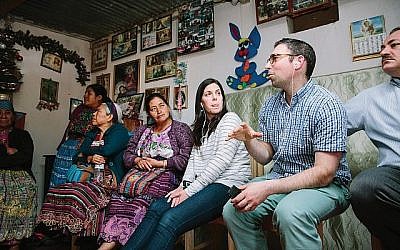 Rabbi Adam Baldachin, second from right, visits home of an indigenous midwife in Quetzaltenango, Guatemala. The collective she belongs to gets funding from AJWS. Courtesy of AJWS