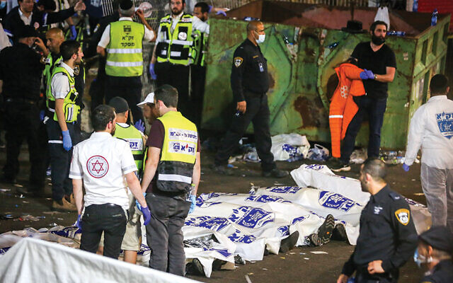 Israeli rescue forces and police at the scene after the deadly events during the celebration of Lag b’Omer on Mount Meron, in northern Israel, on April 30, 2021. (David Cohen/Flash90)