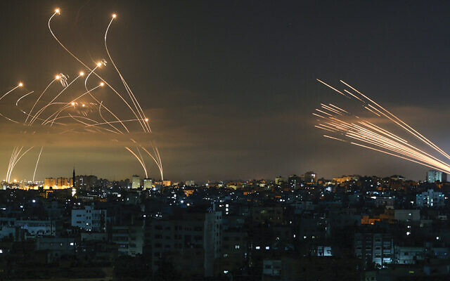 The Iron Dome interceptors, coming from the left, meet a volley of missiles from Gaza on May 14, 2021. (Anas Baba/AFP via Getty Images)
