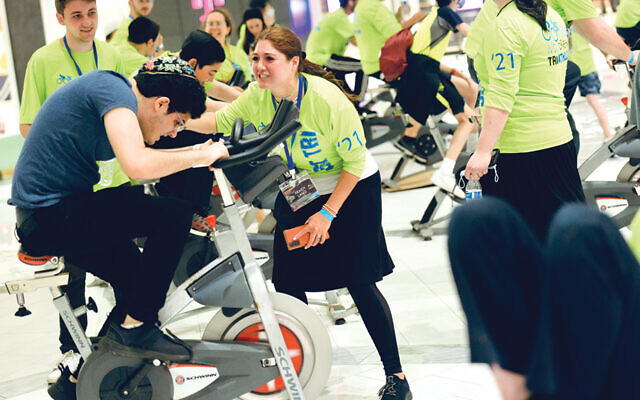 An IVDU student on a bike in the triathlon. (Courtesy OU)