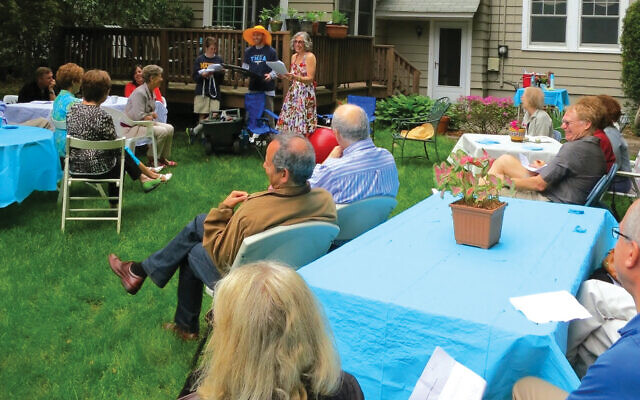 Merrill Silver’s husband, Andy, turned 60 at this party; that’s Merrill in the flowered dress. Merrill Silver’s husband, Andy, turned 60 at this party; that’s Merrill in the flowered dress.