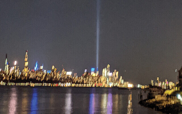 This shaky photograph, taken with an iPhone and great emotion from a balcony in Cliffside Park, shows the Tower of Light over Manhattan on the evening of September 11. (Renee Schlesinger)