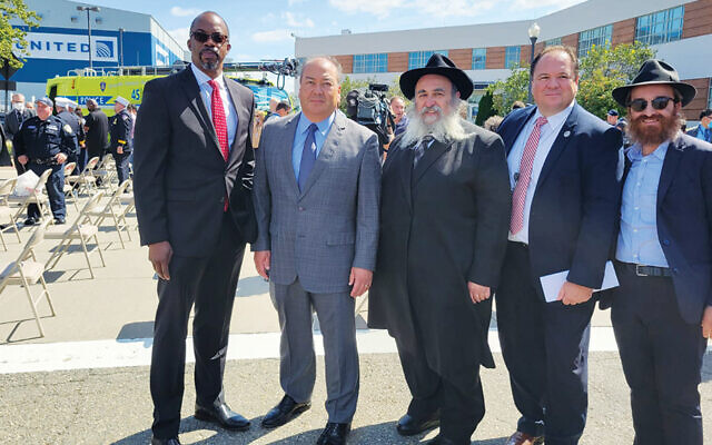 Huntley Lawrence, left, with Kevin O’Toole, Rabbi Mordechai Kanelsky, James Gill, and Rabbi Avremy Kanelsky.  (Courtesy Bris Avrohom)