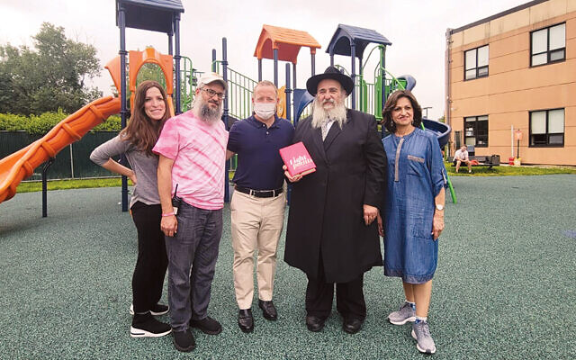 Elke and Rabbi Mendel Zaltzman, directors of the Fair Lawn Jewish Day Camp, Congressman Josh Gottheimer, and Rabbi Mordechai and Shterney Kanelsky of Bris Avrohom. (Courtesy BA)