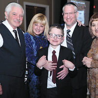 Yoel Feder, star of the evening’s featured documentary “In the Blink of an Eye,” with his proud parents, Michelle and Avi Feder, and his grandparents, Linda and Robert Kinzelberg. Yoel Feder, star of the evening’s featured documentary “In the Blink of an Eye,” with his proud parents, Michelle and Avi Feder, and his grandparents, Linda and Robert Kinzelberg.