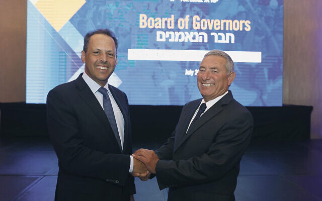 Mark Wilf, left, and Doron Almog, the Jewish Agency’s new chair of the executive, are at the board meeting.